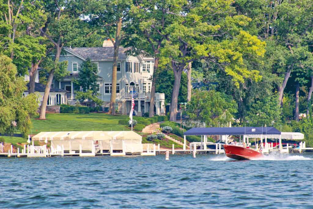 Beautiful lakeside homes with boat docks on Lake Geneva.