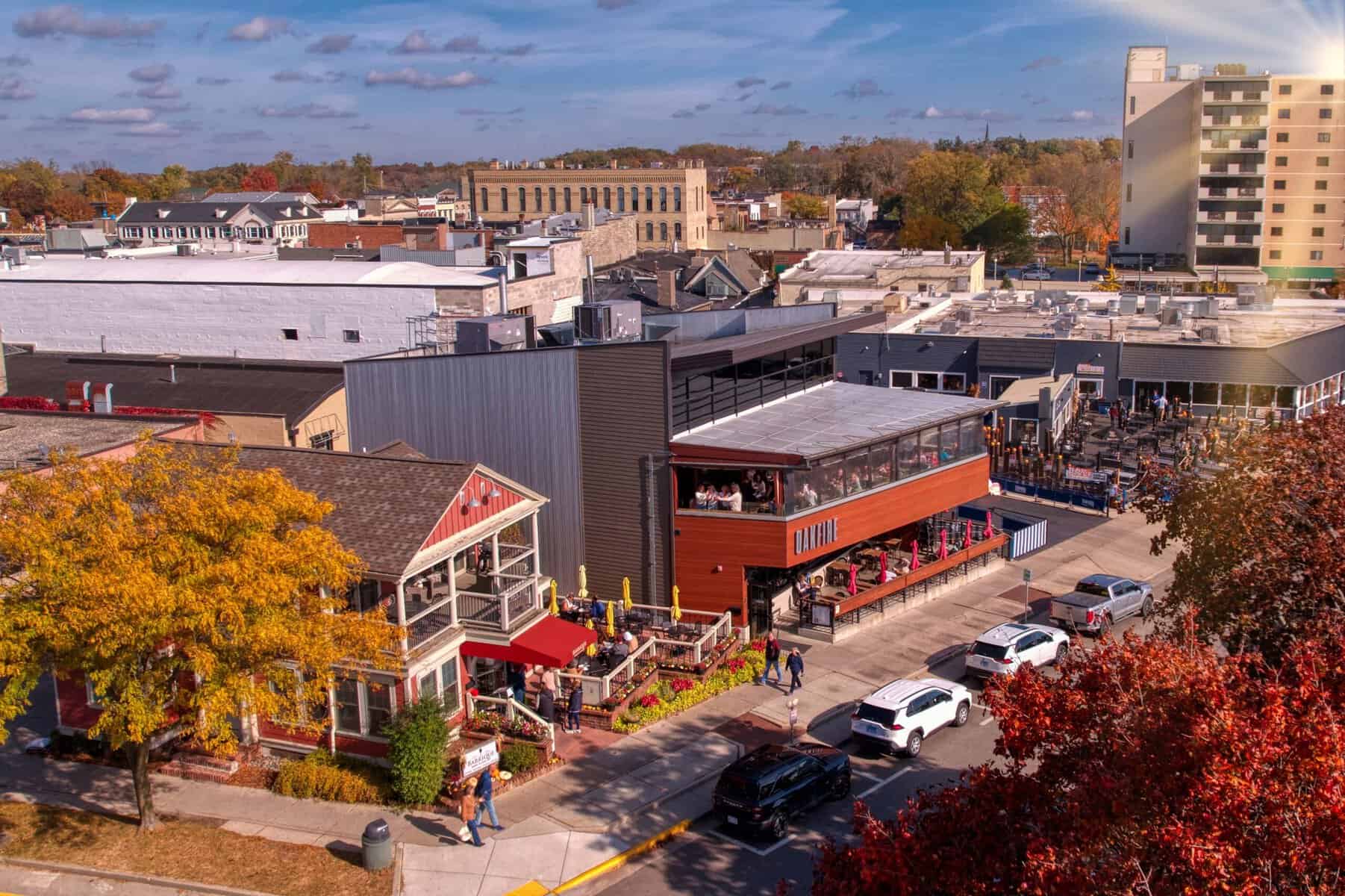 Aerial of Barrique's red-awning patio and Oakfire's glassed-in upper deck on Wrigley Drive in fall