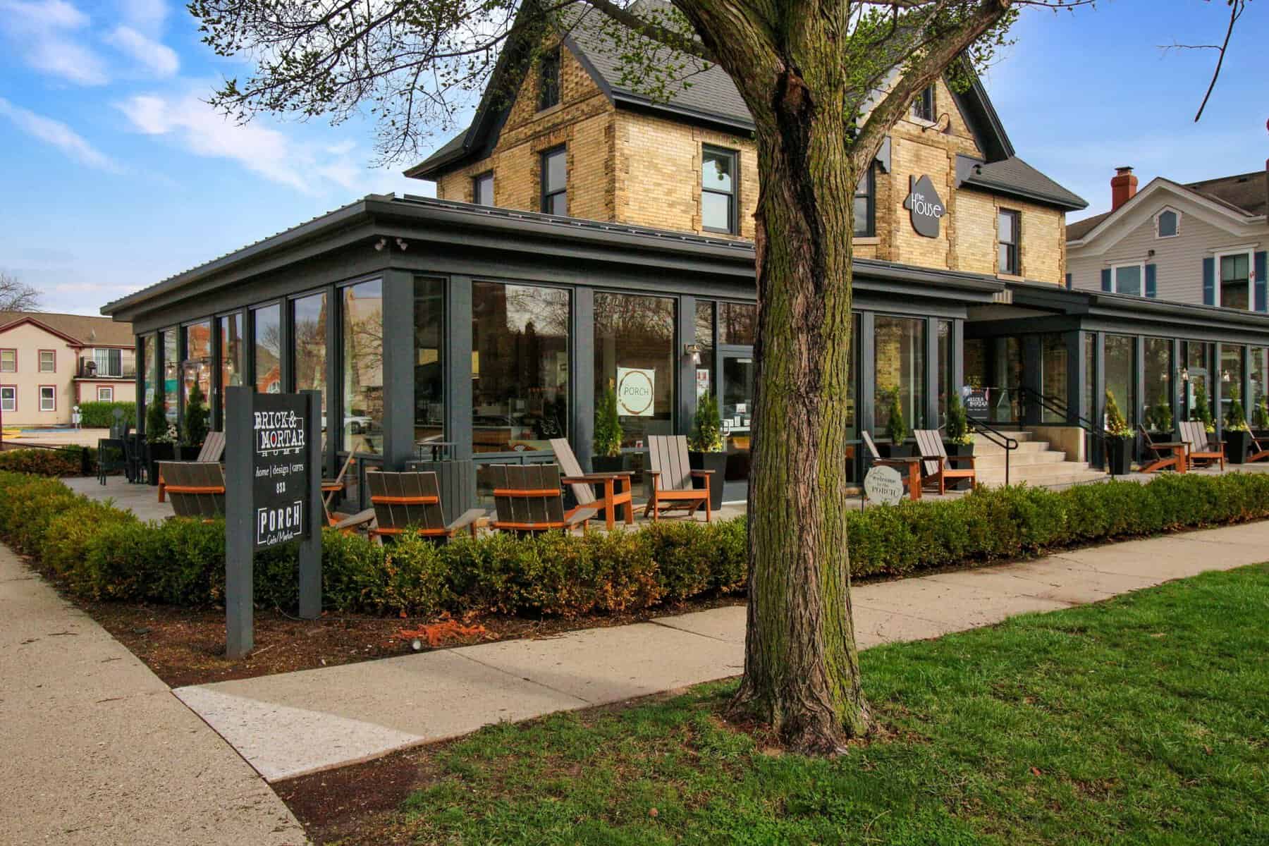 Brick & Mortar Home and The Porch café in a yellow-brick house on Geneva Street