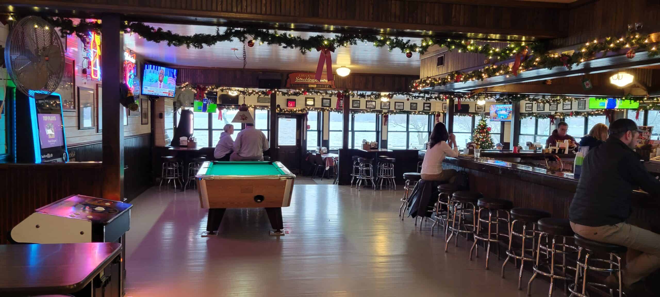 Chuck's Lakeshore Inn barroom with pool table and lake-facing windows