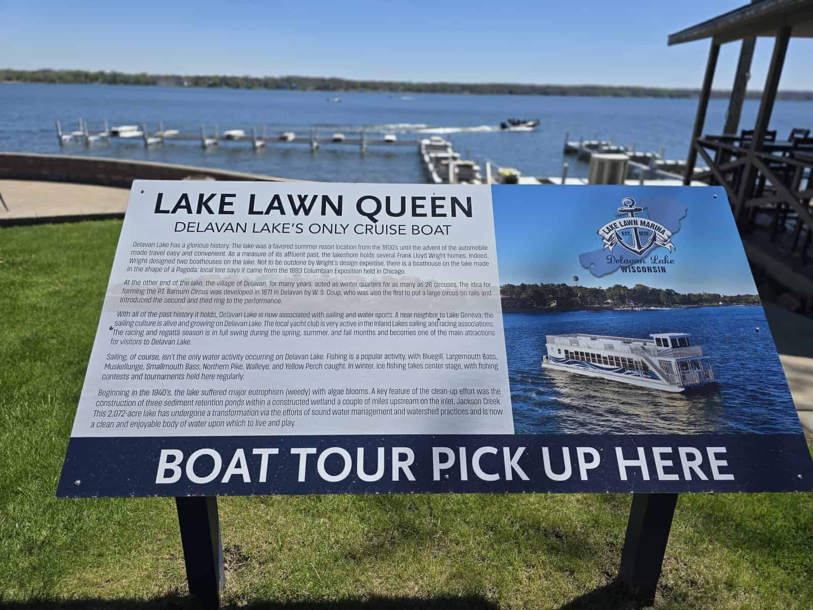 Lake Lawn Queen boat tour pickup sign on the Delavan Lake shore at Lake Lawn Resort