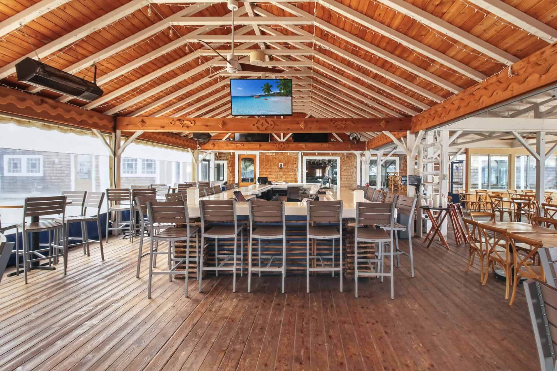 PIER 290's covered outdoor bar with wood ceiling in Williams Bay
