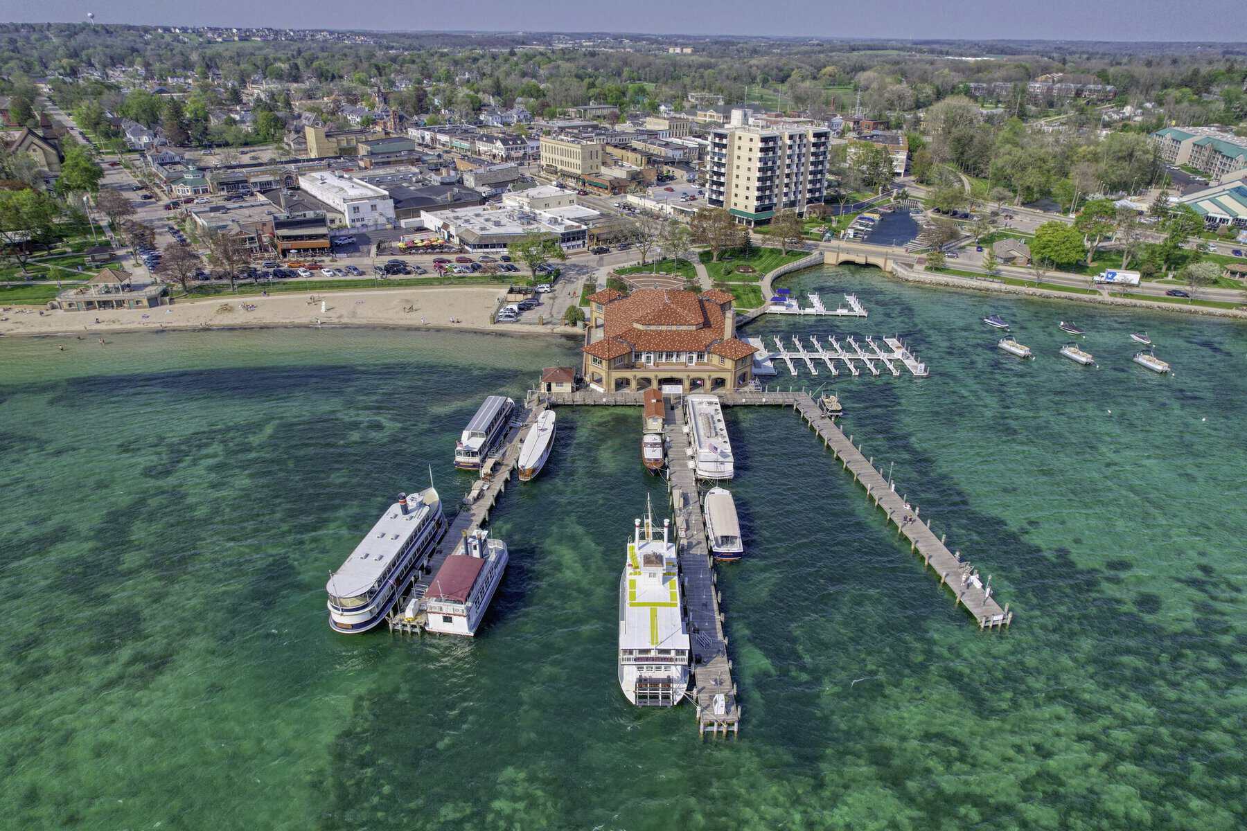 Aerial of the Riviera, its tour-boat piers and Riviera Beach in downtown Lake Geneva